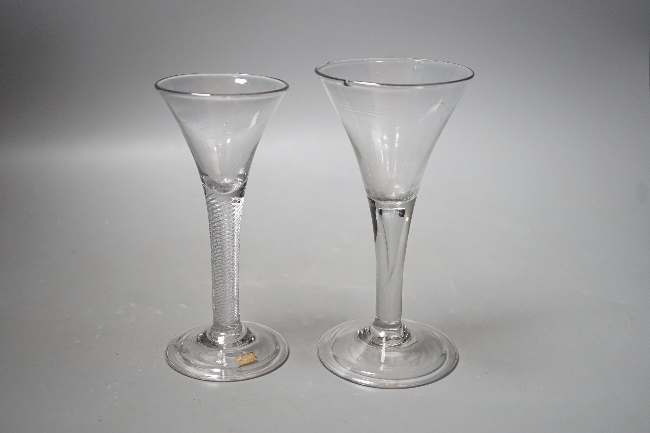 An 18th century airtwist stem wine glass, together with, another 18th century teardrop stem wine glass. Tallest 17.5cm